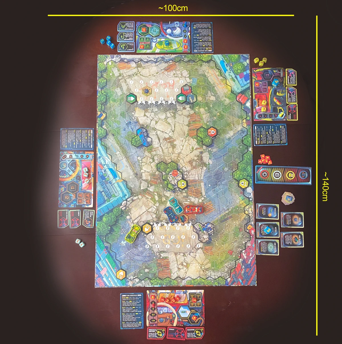A birds eye view of the four player board for Joyride, set up for four players. Measurements around the image indicate table space as approximately 100 by 140 centimeters.