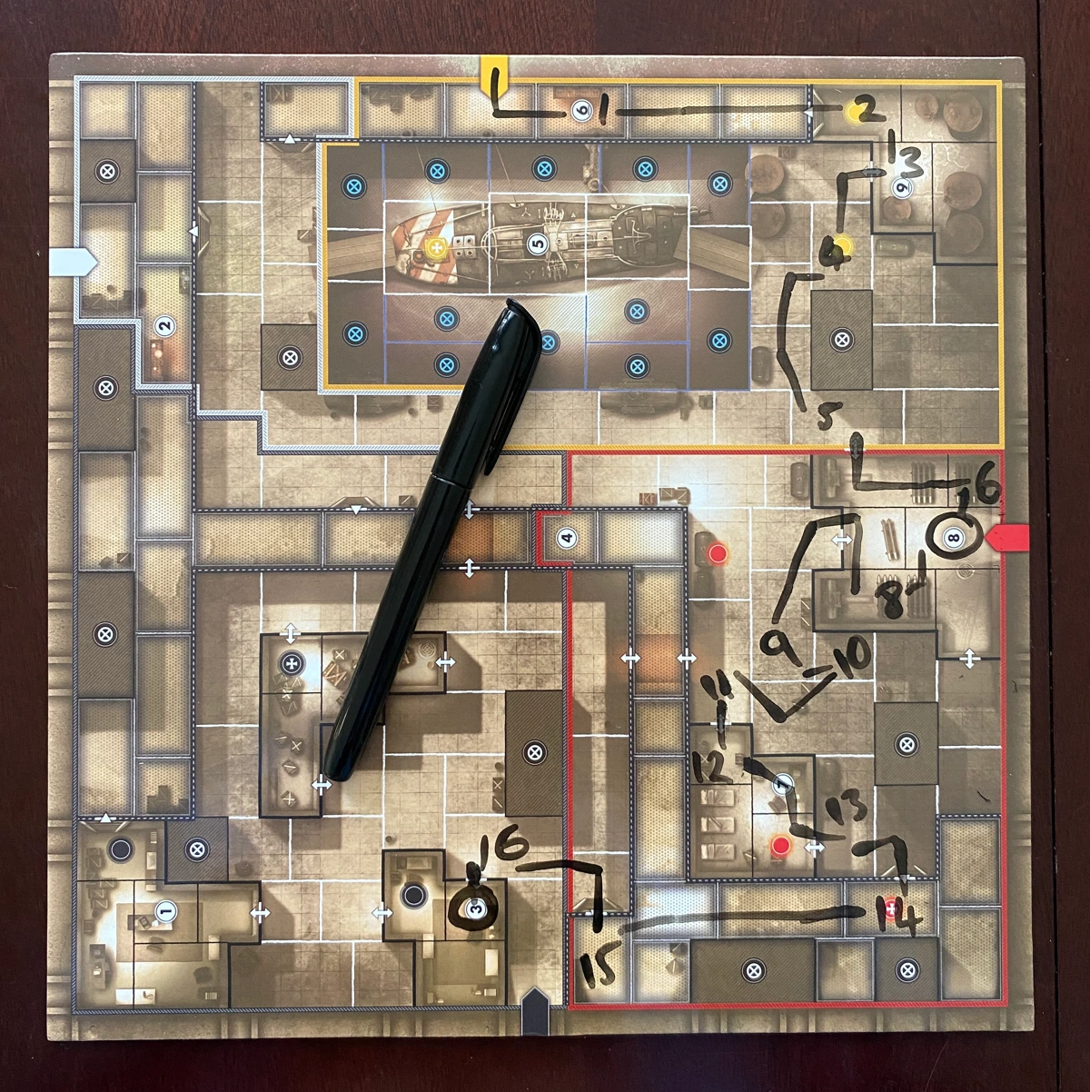 One of the dry-wipe boards for the Sniper with a pen and writing overlaid, showing the Sniper's movements and actions.